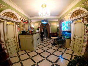 a kitchen filled with furniture and a large window at Hotel Lavilia in Kyiv
