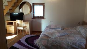 A bed or beds in a room at Casa Rosetta