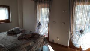 A bed or beds in a room at Casa Rosetta