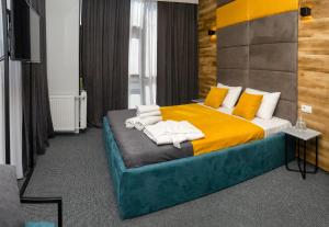Postel nebo postele na pokoji v ubytování BG Palace Hotel
