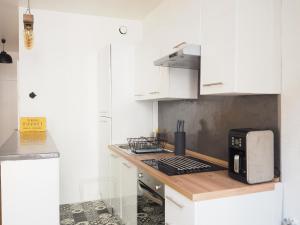 A cozinha ou cozinha compacta de Appartement le st jean - centre historique
