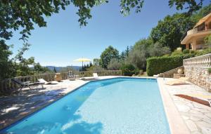 a swimming pool in a yard with a house at Beautifull Villa French Rivera in Spéracèdes