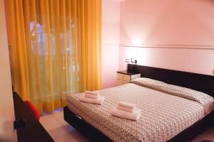 Postel nebo postele na pokoji v ubytování Hotel Letizia + 37 fotografií