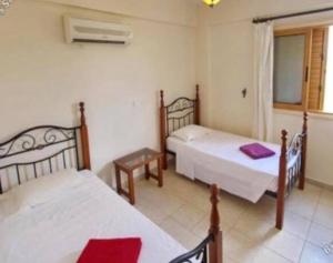 Postel nebo postele na pokoji v ubytování Sunrise Villa + 29 fotografií