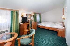 Posteľ alebo postele v izbe v ubytovaní Hotel Spindlerova Bouda