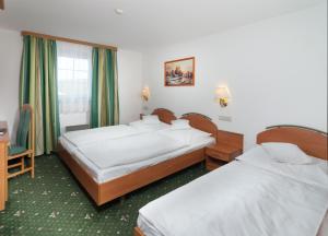 Posteľ alebo postele v izbe v ubytovaní Hotel Spindlerova Bouda