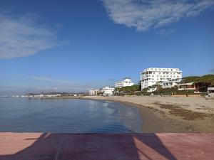 a view of a beach with buildings in the background at Lovely Apartment 2 in Golem