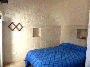 Una cama o camas en una habitación de Il Piccolo Trullo