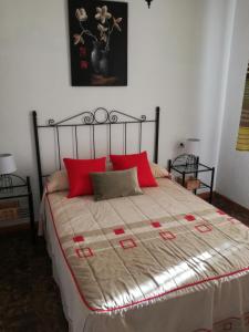 En eller flere senge i et værelse på Alojamiento ROMINA