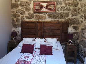 מיטה או מיטות בחדר ב-casa rural La Fragua