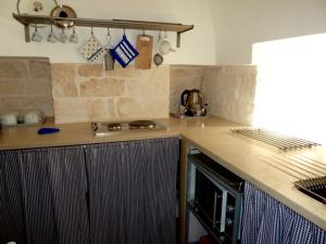 Una cocina o cocineta en Il Piccolo Trullo