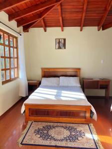 Postel nebo postele na pokoji v ubytování Hosteria San Carlos Tababela