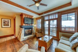a living room with a couch and a fireplace at Luxury Ski Hill Condos in Breckenridge