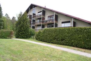 a building with a path in front of it at Felsenland Apartment in Ludwigswinkel