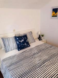 Postel nebo postele na pokoji v ubytování Apartments Barbaresko
