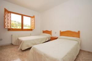 Un pat sau paturi într-o cameră la Club Villamar - Tinoco