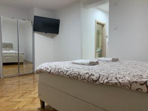 Postel nebo postele na pokoji v ubytování Simic Apartman