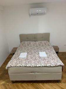 Postel nebo postele na pokoji v ubytování Simic Apartman