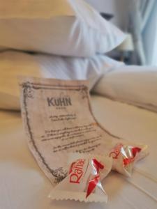 a packet of kronilla sitting on top of a bed at Casa Kuhn in Sighişoara