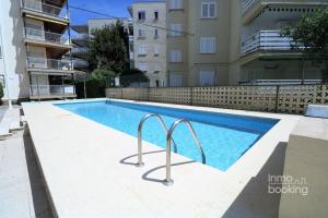 The swimming pool at or close to InmoBooking LeriMar