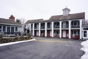 a parking lot in front of a large building at Stay Saratoga in Saratoga Springs