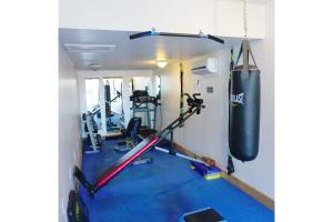 a room with a punching bag and a gym at Stay Saratoga in Saratoga Springs