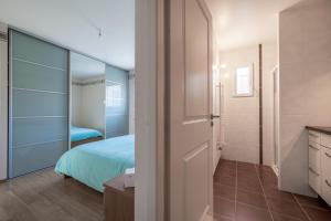 Ένα ή περισσότερα κρεβάτια σε δωμάτιο στο Maison avec piscine 8 couchages entre Annecy et Aix les bains +10 φωτογραφίες