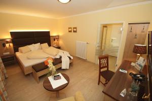 Posteľ alebo postele v izbe v ubytovaní Flairhotel am Wörthersee