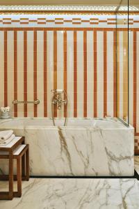 a bathroom with a tub and a sink at Splendido Mare, A Belmond Hotel, Portofino in Portofino