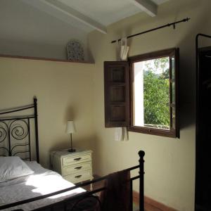 A bed or beds in a room at Casita la Luna Rosa