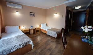 Postel nebo postele na pokoji v ubytování Salute Hotel + 37 fotografií