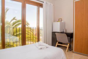 Postel nebo postele na pokoji v ubytování Hostal Gran Sol