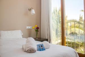Postel nebo postele na pokoji v ubytování Hostal Gran Sol