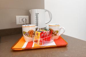 Příslušenství pro přípravu čaje a kávy v ubytování Orange house