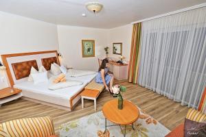 Posteľ alebo postele v izbe v ubytovaní Flairhotel am Wörthersee