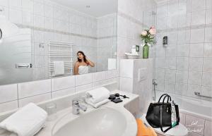 Kúpeľňa v ubytovaní Flairhotel am Wörthersee