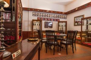 a dining room with a table and chairs at Shah's Beach Resort Melaka in Melaka
