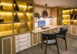 a home office with a desk and chairs at Hotel San Sebastián Orly, Affiliated by Meliá in Donostia-San Sebastián