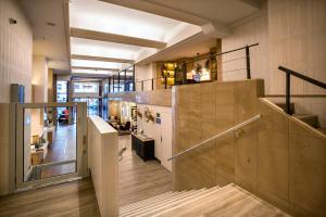 a large room with a staircase in a building at Hotel San Sebastián Orly, Affiliated by Meliá in Donostia-San Sebastián