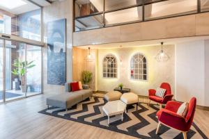a lobby with chairs and a waiting room at Hotel San Sebastián Orly, Affiliated by Meliá in Donostia-San Sebastián