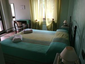 Postel nebo postele na pokoji v ubytování B&B SABRINA