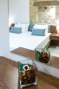 A bed or beds in a room at Agarathos Deluxe Homes - Kaliviani -On the road to Balos