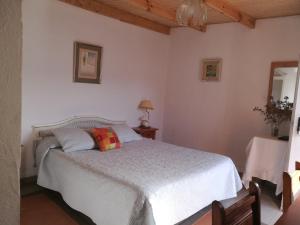 
Łóżko lub łóżka w pokoju w obiekcie Residencia Los Conejos - Bike & Motorbike
