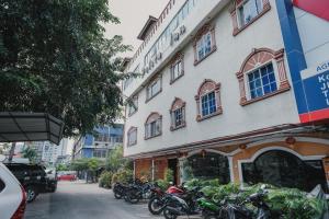 a group of motorcycles parked in front of a building at Reddoorz near Nagoya Hill Mall Batam 5 in Batam Center