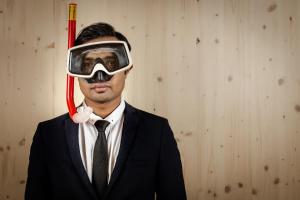 a man in a suit and a gas mask at Zero Box Lodge Porto in Porto
