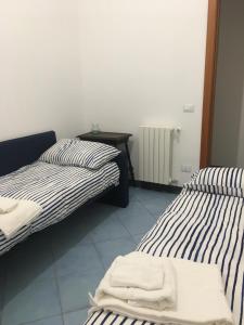 Ένα ή περισσότερα κρεβάτια σε δωμάτιο στο La Casa di Lalla
