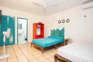 Postel nebo postele na pokoji v ubytování Casa Cálido Hotel