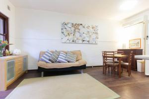 a living room with a couch and a table at B3 Crawley Apartment 1 BRM & Sleepout near UWA in Perth
