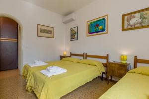 Postel nebo postele na pokoji v ubytování Villa Fasanella: Cottage sulla spiaggia