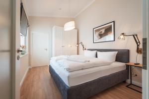 En eller flere senge i et værelse på Das Handtuchhaus - Wohnen im schmalsten Haus - Mittendrin